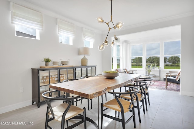 dining area featuring crown molding and baseboards