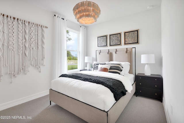 carpeted bedroom with baseboards