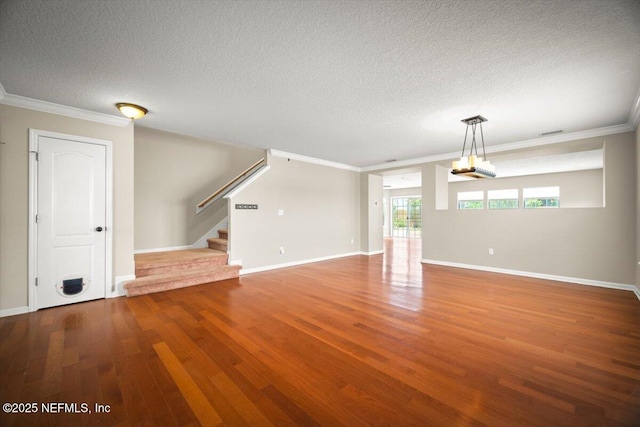 12198 Pebble Point Dr S, Jacksonville, FL 32218 - unfurnished living room with stairway, wood finished floors, a textured ceiling, crown molding, and baseboards
