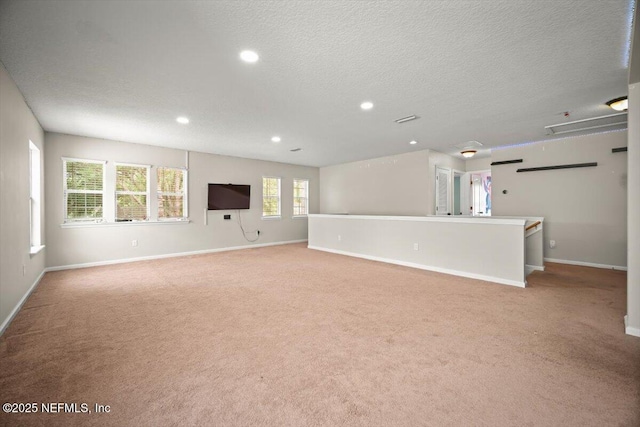 12198 Pebble Point Dr S, Jacksonville, FL 32218 - unfurnished living room with carpet, baseboards, recessed lighting, and a textured ceiling