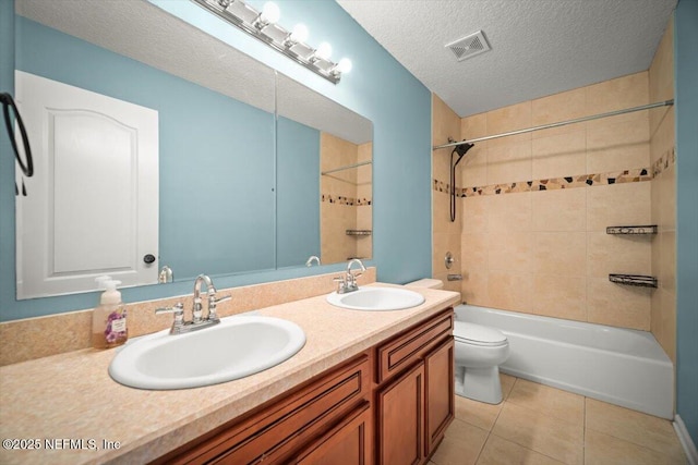 12198 Pebble Point Dr S, Jacksonville, FL 32218 - full bath featuring tile patterned floors, shower / washtub combination, toilet, double vanity, and a textured ceiling