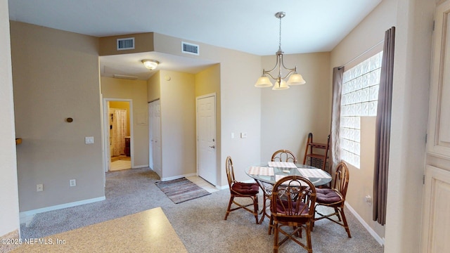 dining space featuring carpet, a chandelier, and baseboards