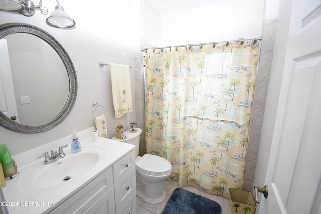 bathroom featuring vanity, toilet, curtained shower, and tile patterned flooring
