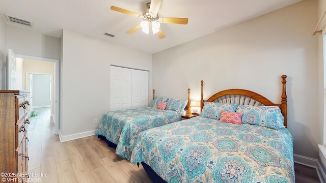 96069 Hidden Marsh Ln, Fernandina Beach, FL 32034 - bedroom featuring a closet, wood finished floors, baseboards, and ceiling fan