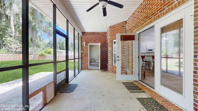 96069 Hidden Marsh Ln, Fernandina Beach, FL 32034 - unfurnished sunroom featuring a ceiling fan