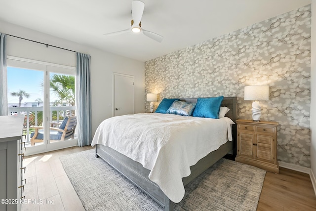 626 Ponte Vedra Blvd Unit B6, Ponte Vedra Beach, FL 32082 - bedroom with access to exterior, wallpapered walls, an accent wall, baseboards, and light wood-style flooring