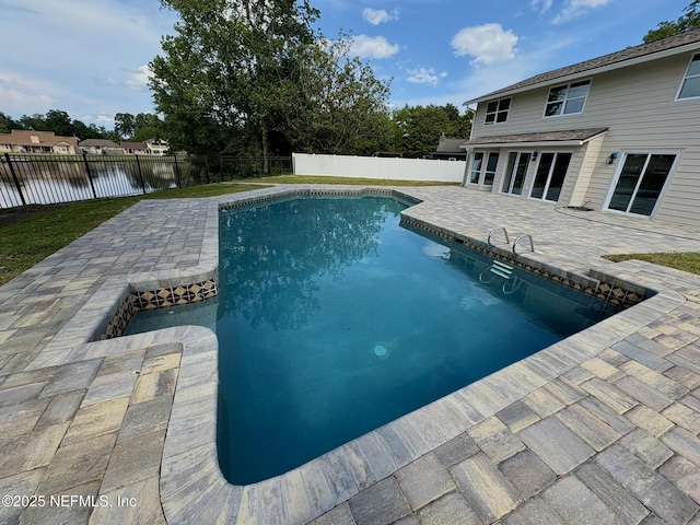 946 Cedar Ridge Ct, Orange Park, FL 32065 - view of swimming pool featuring a patio, a fenced backyard, and a water view