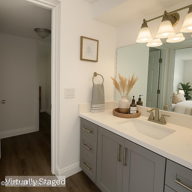 946 Cedar Ridge Ct, Orange Park, FL 32065 - bathroom with wood finished floors, baseboards, and vanity