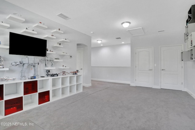 195 Manor Ln, Saint Johns, FL 32259 - unfurnished living room featuring carpet floors, arched walkways, attic access, and baseboards