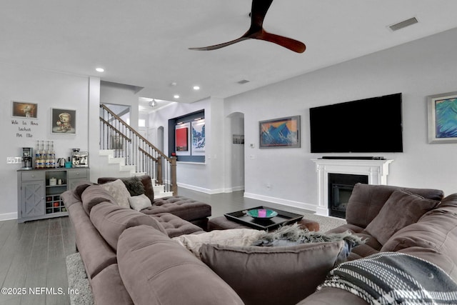 195 Manor Ln, Saint Johns, FL 32259 - living area featuring ceiling fan, baseboards, stairway, arched walkways, and wood finished floors