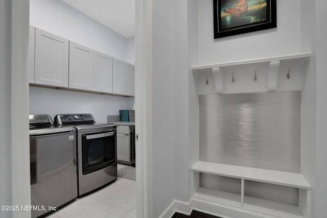 195 Manor Ln, Saint Johns, FL 32259 - laundry area featuring separate washer and dryer, cabinet space, and light tile patterned flooring
