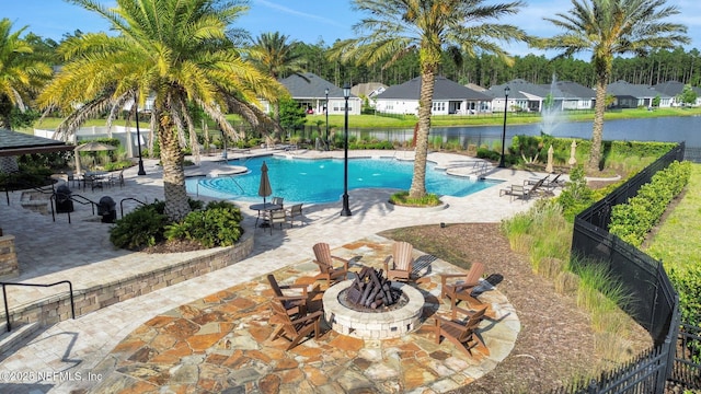 195 Manor Ln, Saint Johns, FL 32259 - community pool featuring an outdoor fire pit, fence, a patio area, a water view, and a residential view