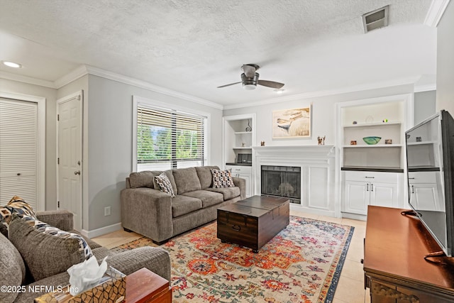 10200 Belle Rive Blvd Unit 136, Jacksonville, FL 32256 - living area with light tile patterned floors, a ceiling fan, built in shelves, crown molding, and a fireplace