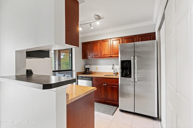 10200 Belle Rive Blvd Unit 136, Jacksonville, FL 32256 - kitchen featuring stainless steel appliances, a sink, light tile patterned flooring, crown molding, and a peninsula