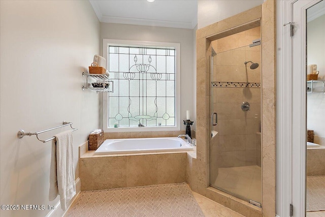 bathroom with a stall shower, plenty of natural light, a garden tub, and ornamental molding
