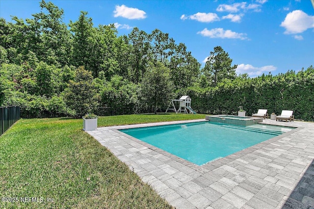 view of pool with a patio, a playground, and a pool with connected hot tub