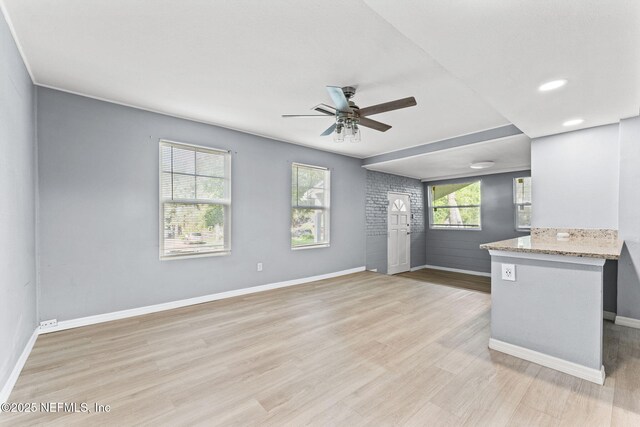 2617 Lake Shore Blvd, Jacksonville, FL 32210 - unfurnished living room featuring a ceiling fan, baseboards, light wood-type flooring, and recessed lighting