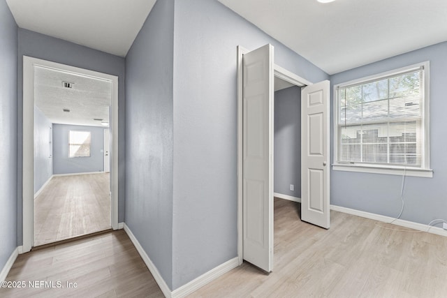 2617 Lake Shore Blvd, Jacksonville, FL 32210 - hallway with light wood-style floors and baseboards