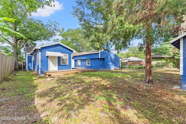 2617 Lake Shore Blvd, Jacksonville, FL 32210 - back of property featuring fence and a wooden deck