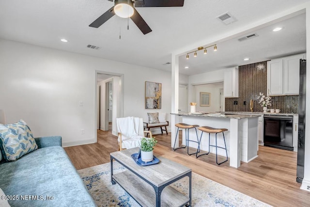 5530 Sharon Ter, Jacksonville, FL 32207 - living area with a ceiling fan, light wood-style flooring, baseboards, and recessed lighting