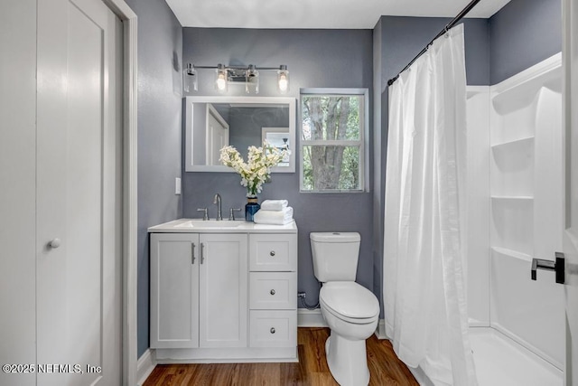 5530 Sharon Ter, Jacksonville, FL 32207 - bathroom featuring wood finished floors, curtained shower, toilet, and baseboards