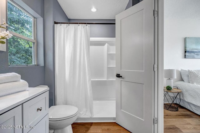 5530 Sharon Ter, Jacksonville, FL 32207 - full bath with wood finished floors, healthy amount of natural light, toilet, a shower with curtain, and recessed lighting
