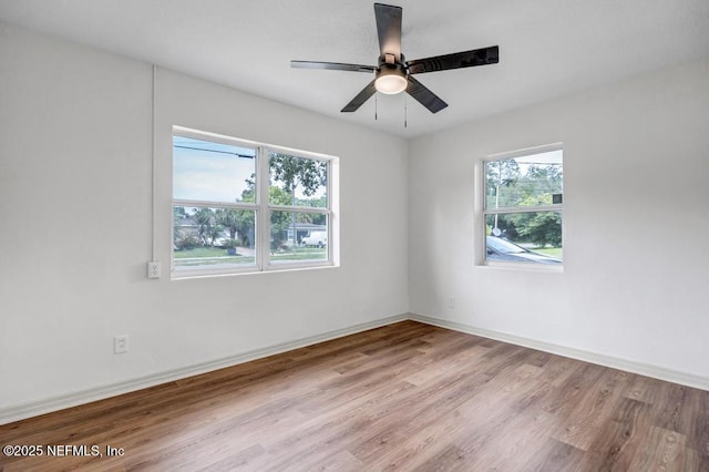 5530 Sharon Ter, Jacksonville, FL 32207 - unfurnished room featuring wood finished floors, baseboards, and ceiling fan