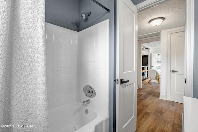 5530 Sharon Ter, Jacksonville, FL 32207 - bathroom featuring wood finished floors, shower / bath combination with curtain, and a textured ceiling