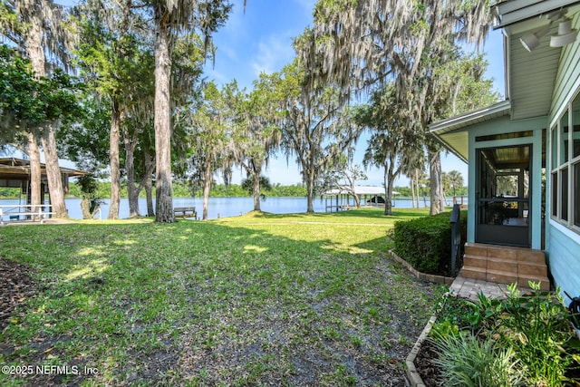 130 Woodbury Trl, Satsuma, FL 32189 - view of green lawn featuring entry steps and a water view