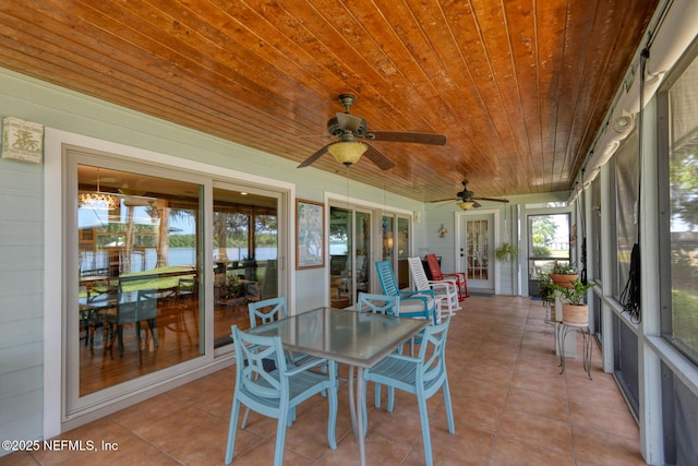 130 Woodbury Trl, Satsuma, FL 32189 - sunroom with a ceiling fan, outdoor dining area, and a water view