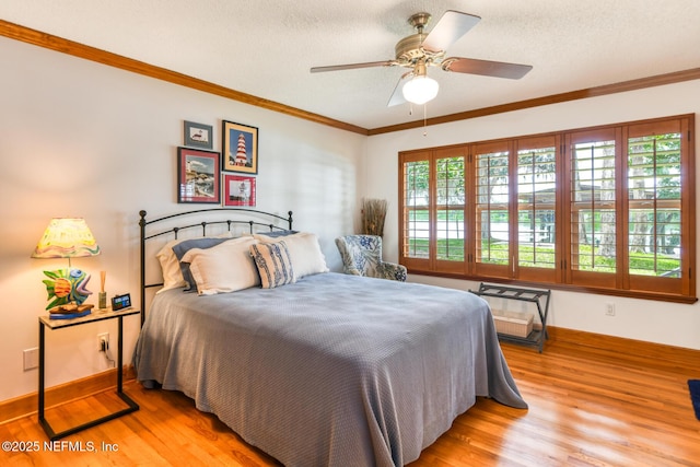130 Woodbury Trl, Satsuma, FL 32189 - bedroom featuring light wood finished floors, baseboards, ornamental molding, and ceiling fan