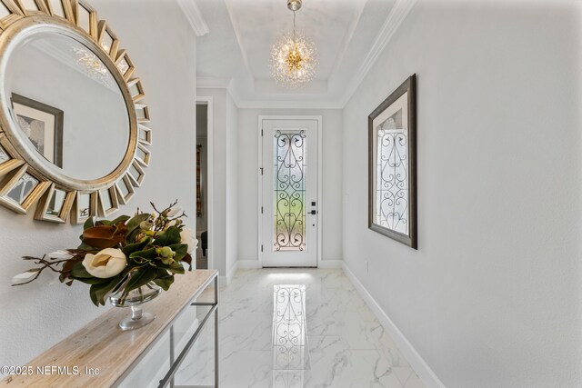 360 Rustic Mill Dr, Saint Augustine, FL 32092 - foyer entrance with a chandelier, light marble finish flooring, baseboards, ornamental molding, and a raised ceiling