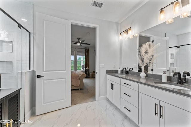 360 Rustic Mill Dr, Saint Augustine, FL 32092 - bathroom featuring a ceiling fan, a tile shower, marble finish flooring, double vanity, and baseboards