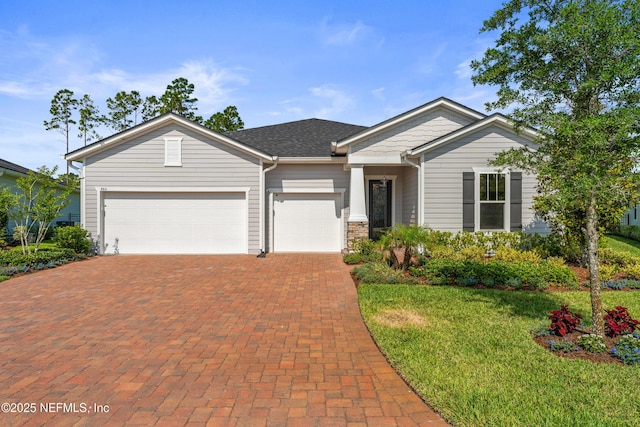 360 Rustic Mill Dr, Saint Augustine, FL 32092 - view of front of property with decorative driveway, an attached garage, and a front lawn