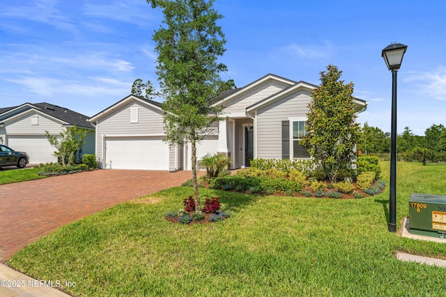 360 Rustic Mill Dr, Saint Augustine, FL 32092 - ranch-style house with decorative driveway, an attached garage, and a front yard