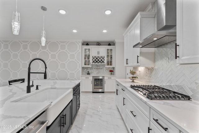 360 Rustic Mill Dr, Saint Augustine, FL 32092 - kitchen with wall chimney range hood, beverage cooler, appliances with stainless steel finishes, white cabinetry, and pendant lighting