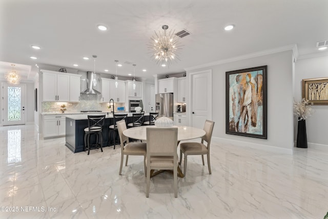 360 Rustic Mill Dr, Saint Augustine, FL 32092 - dining room with crown molding, recessed lighting, a chandelier, baseboards, and light marble finish floors