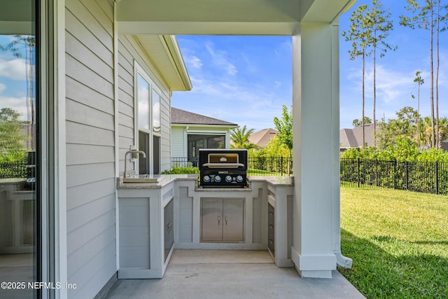 360 Rustic Mill Dr, Saint Augustine, FL 32092 - view of patio featuring a grill, exterior kitchen, and a sink