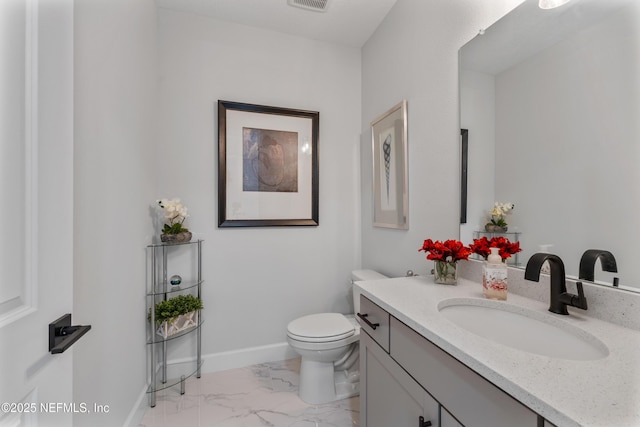 360 Rustic Mill Dr, Saint Augustine, FL 32092 - half bathroom with marble finish floors, toilet, vanity, and baseboards