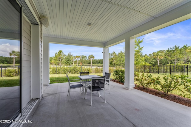 360 Rustic Mill Dr, Saint Augustine, FL 32092 - view of patio featuring outdoor dining space, a fenced backyard, and view of scattered trees