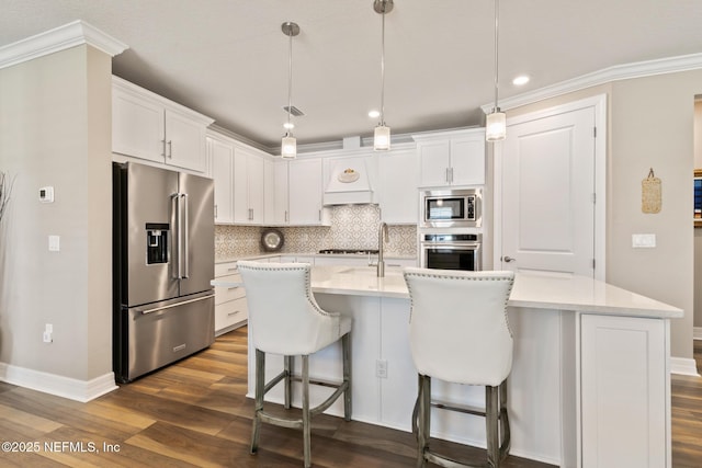 223 Creek Pebble Dr, Ponte Vedra, FL 32081 - kitchen with stainless steel appliances, dark wood-style flooring, ornamental molding, light countertops, and white cabinets