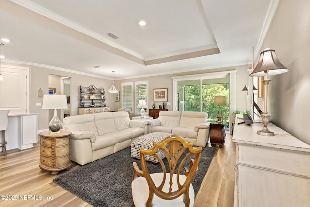 223 Creek Pebble Dr, Ponte Vedra, FL 32081 - living area with light wood finished floors, crown molding, a tray ceiling, and recessed lighting