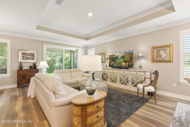 223 Creek Pebble Dr, Ponte Vedra, FL 32081 - living area with a tray ceiling, wood finished floors, ornamental molding, plenty of natural light, and recessed lighting