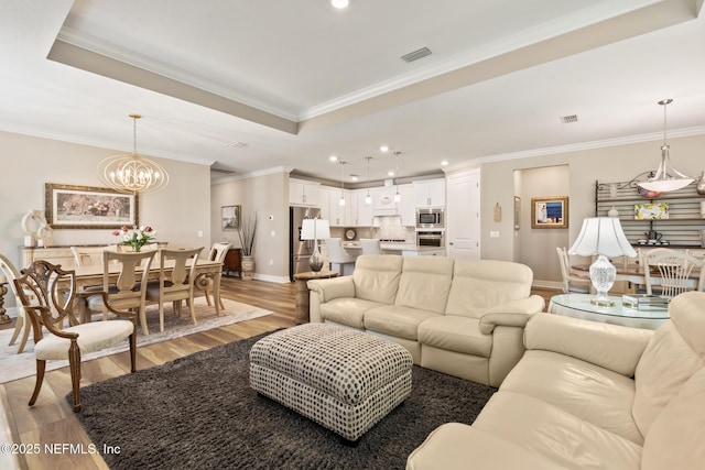 223 Creek Pebble Dr, Ponte Vedra, FL 32081 - living room featuring baseboards, wood finished floors, recessed lighting, a chandelier, and ornamental molding