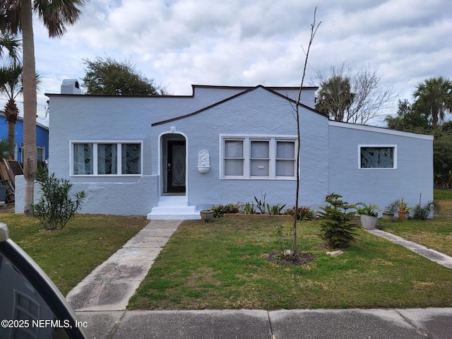 123 Arlington Way, Ormond Beach, FL 32176 - view of front of property with stucco siding and a front yard