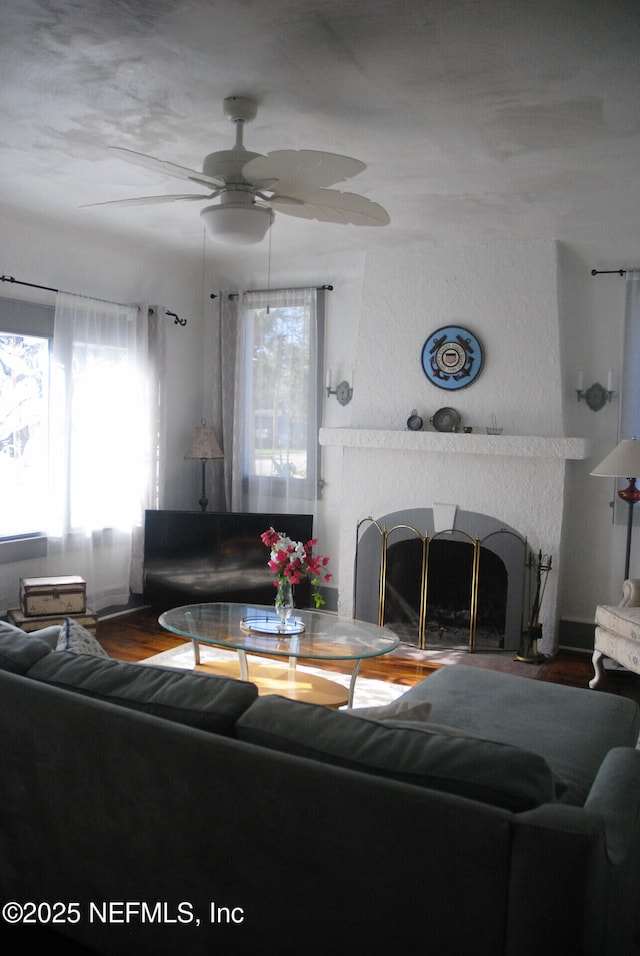 123 Arlington Way, Ormond Beach, FL 32176 - living room with a fireplace, a ceiling fan, healthy amount of natural light, and wood finished floors
