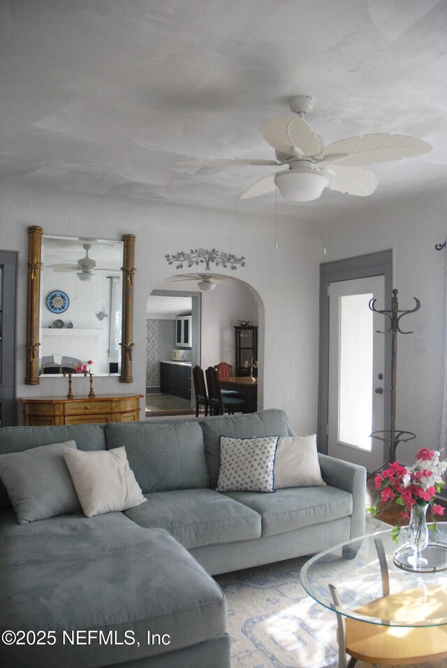 123 Arlington Way, Ormond Beach, FL 32176 - living room featuring arched walkways and a ceiling fan