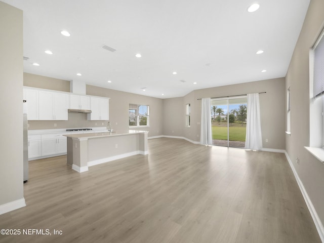 471 Rum Runner Way, Saint Johns, FL 32259 - unfurnished living room with healthy amount of natural light, light wood-style floors, baseboards, and recessed lighting