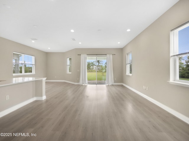471 Rum Runner Way, Saint Johns, FL 32259 - unfurnished living room with baseboards, light wood-type flooring, and recessed lighting