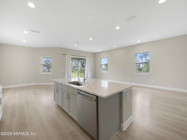 471 Rum Runner Way, Saint Johns, FL 32259 - kitchen with dishwasher, a sink, open floor plan, light wood-type flooring, and recessed lighting